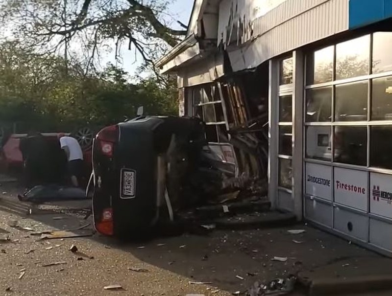 The aftermath of a fatal car accident in which a Chevy Malibu went airborne into a mechanic shop. - USED WITH PERMISSION/SCREENSHOT VIA FACEBOOK