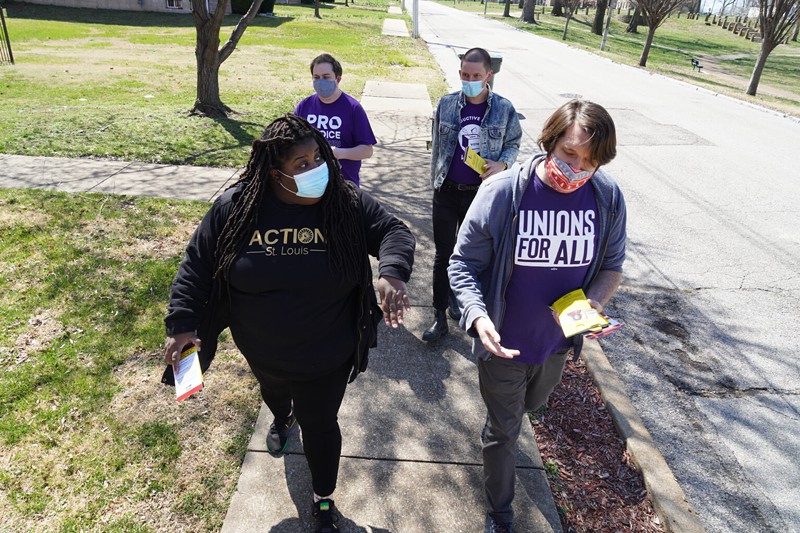Kayla Reed (front left) joins volunteers from labor unions and NARAL Pro-Choice Missouri to knock on doors in a majority-Black neighborhood to advocate for Tishaura Jones in March. - LAWRENCE BRYANT