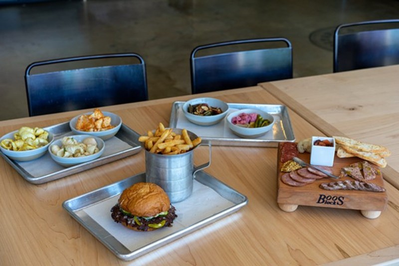 The new location's larger kitchen gives Bolyard and his crew the space to expand the menu with burgers, sides, charcuterie, salads and more. - HOLDEN HINDES