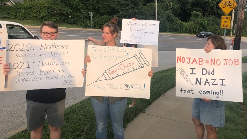 Protesters outside of Mercy Hospital St. Louis   on Sunday protest a policy to require employees to get vaccinated. - VICTOR STEFANESCU