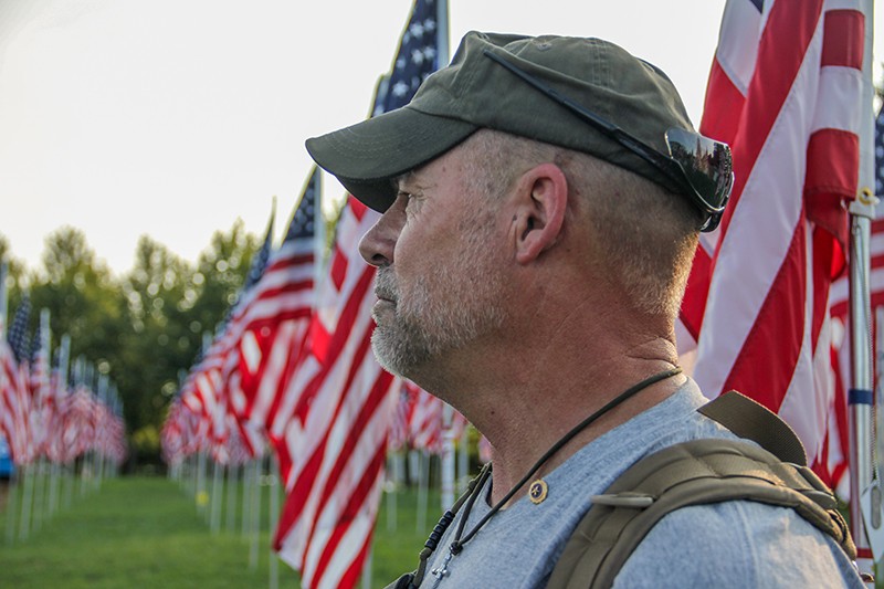 "Every time I touch a flag, it's like every fiber, every stitch, is another veteran that has lost their lives," Presson says. - DANNY WICENTOWSKI