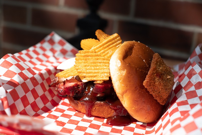 "The Lou" sandwich is made with barbecued pork steak and topped with Red Hot Riplets. - PHUONG BUI