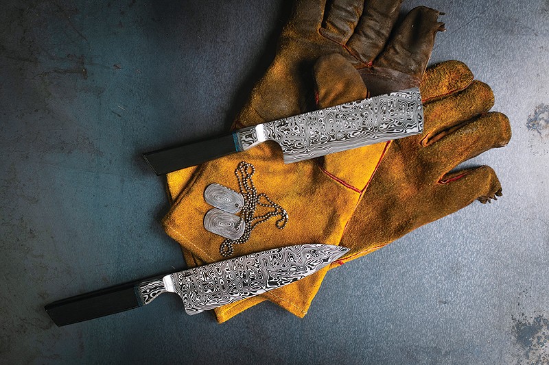 Knives and dog tags from Bonner's space-themed collection, forged from one-inch round bar Damasteel. - SPENCER PERNIKOFF