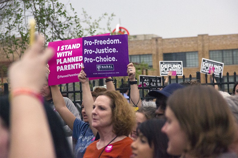 Planned Parenthood supporters at a rally. - DANNY WICENTOWSKI
