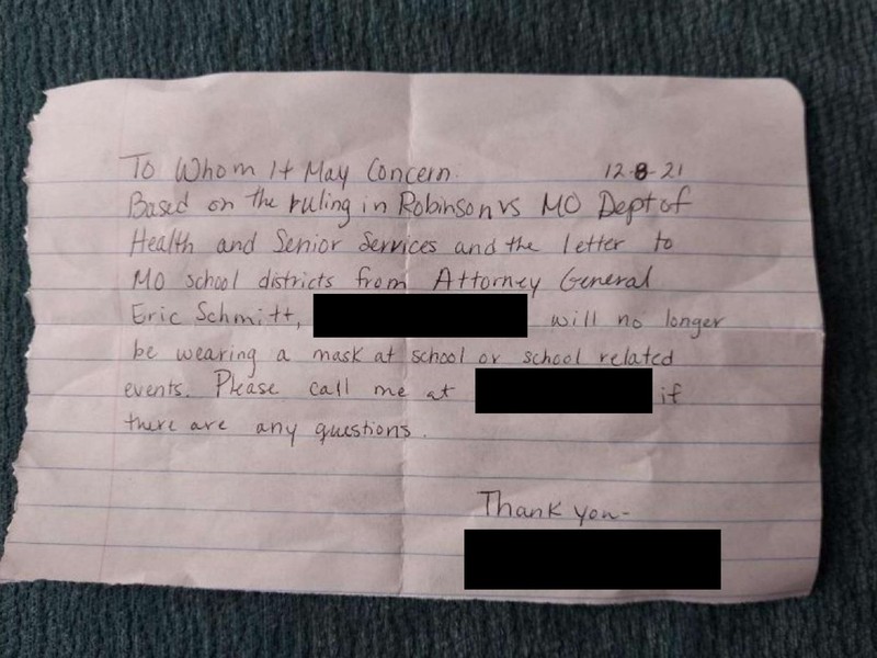 A note (redacted by RFT) that one mom gave her children on December 8, stating that they do not need to wear a mask. - MISSOURI ATTORNEY GENERAL'S OFFICE