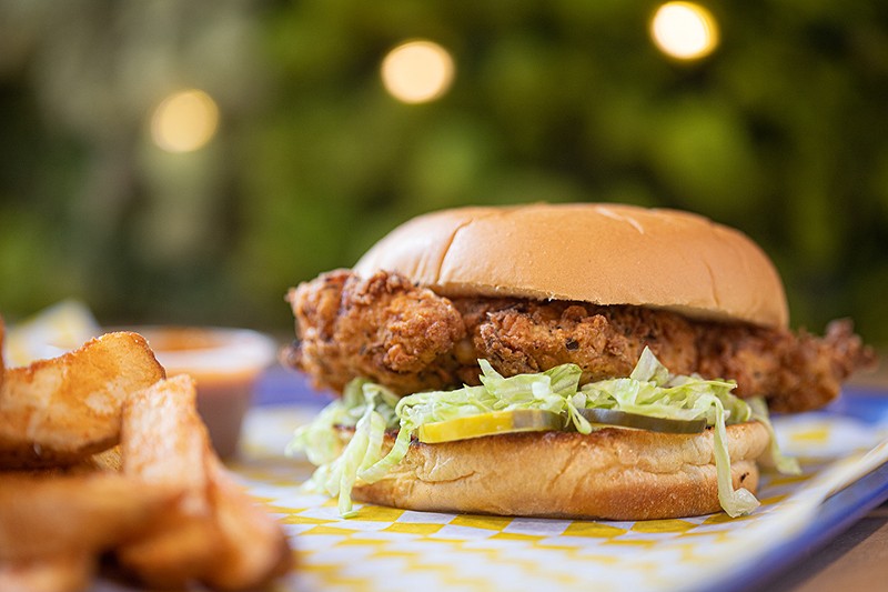 The "Crispy Chicken" pairs boneless fried chicken with onions, pickles and choice of sauce on a soft bun. - Mabel Suen