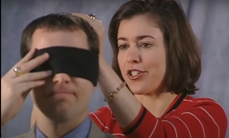 Brook gets blindfolded by Amy to test how well he knows the furniture in a classic Carol House Furniture ad.  - SCREENGRAB FROM YOUTUBE / CAROL HOUSE FURNITURE