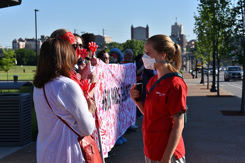 SLUH Union Labor Representative Jenn Dean talks with the protesting nurses. - Jessica Rogen