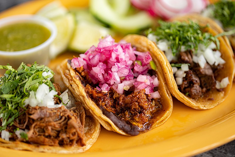 Sabroso serves a variety of street tacos, including those stuffed with the house specialty, cochinita pibil. - Mabel Suen
