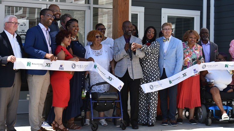 Elected officials, residents and faith leaders belatedly cut the ribbon on Scott Manor Senior Living Apartments in North County. - Ryan Krull