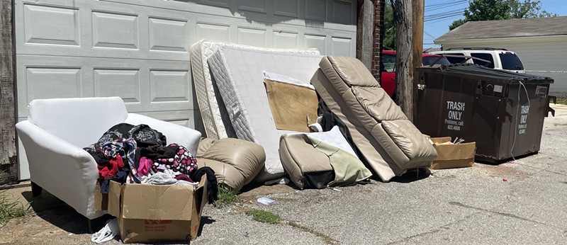 Mattresses are piled up in this Princeton Heights alley. - BENJAMIN SIMON