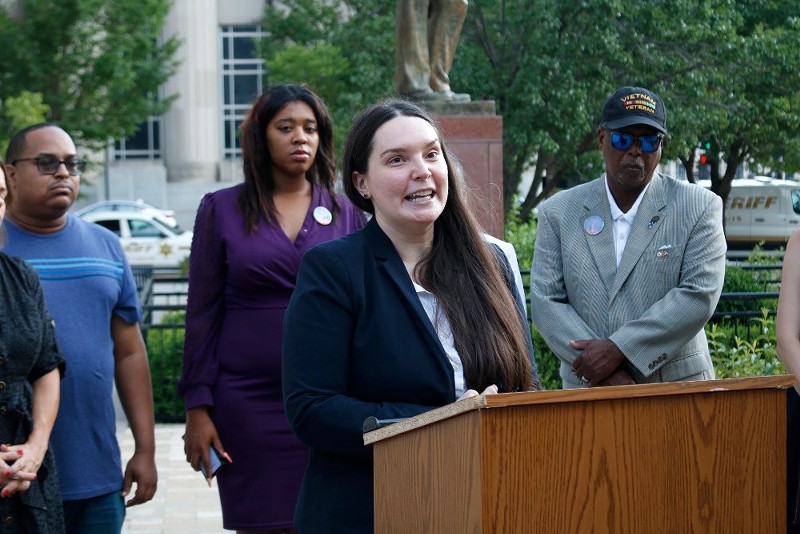 Amy Harms speaks outside the Civil Courts building in St. Louis.