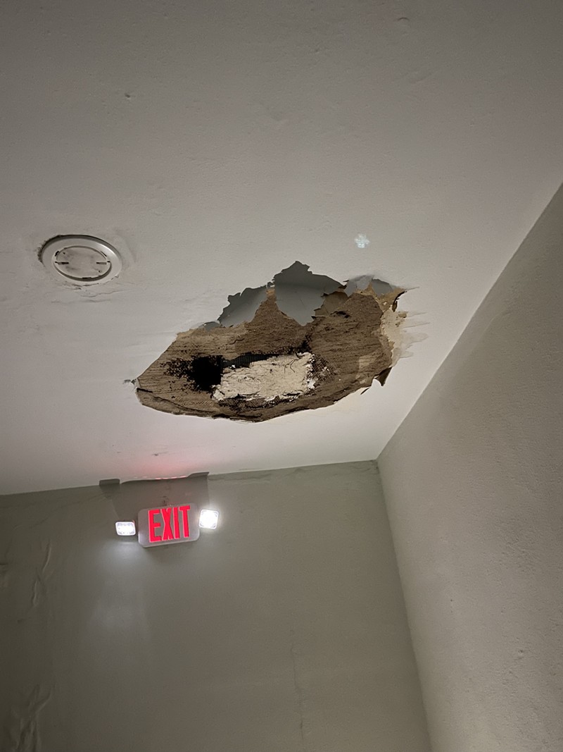 Water leaks from the ceiling after the recent rain storms at Raphael Apartments. - VIA ALEX