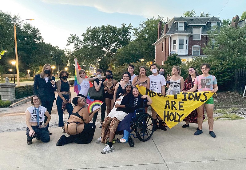 After protesting an anti-abortion group, Resist STL gathered for a group photo. - VIA RESIST STL