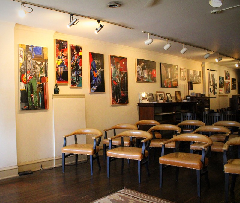 The art gallery has paintings from a local artist.