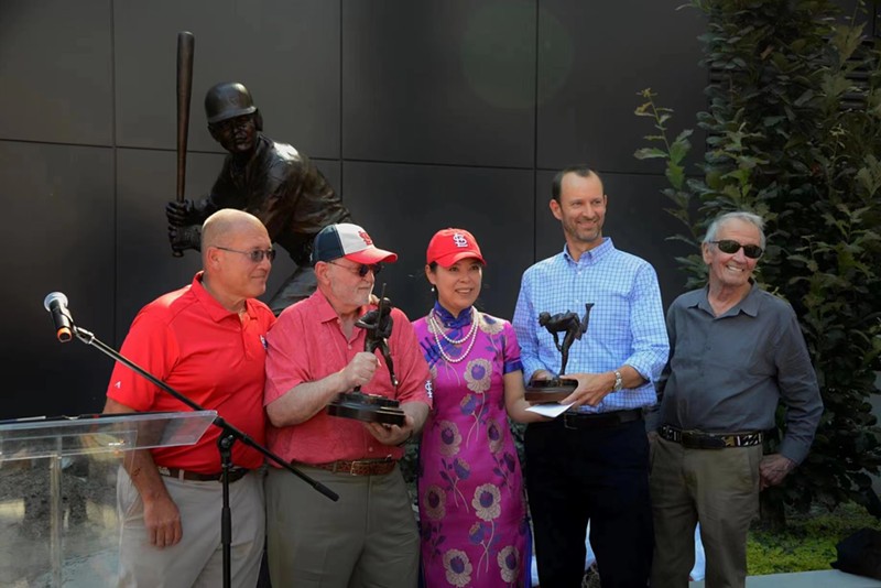 Neal Perryman, Tim Hermann, He Jian Ping, Bill DeWitt III, and Harry Weber in front of the new statue.