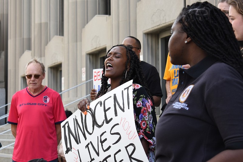 Inez Bordeaux screams "We have nothing to lose but our chains" in front of the St. Louis City Judicial Court Building. - Monica Obradovic