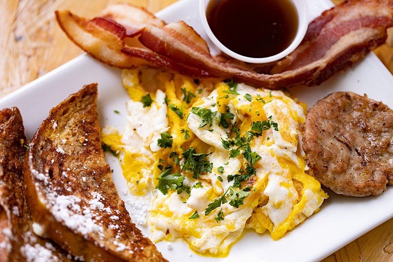 The breakfast platter includes French toast, eggs, bacon and sausage. - Mabel Suen