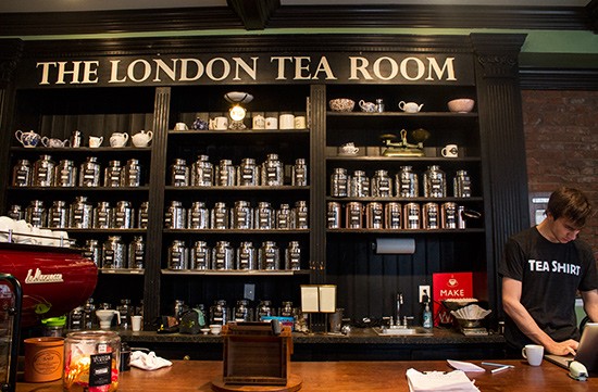 A shelf at the London Tea Room holds many jars of tea for sale.