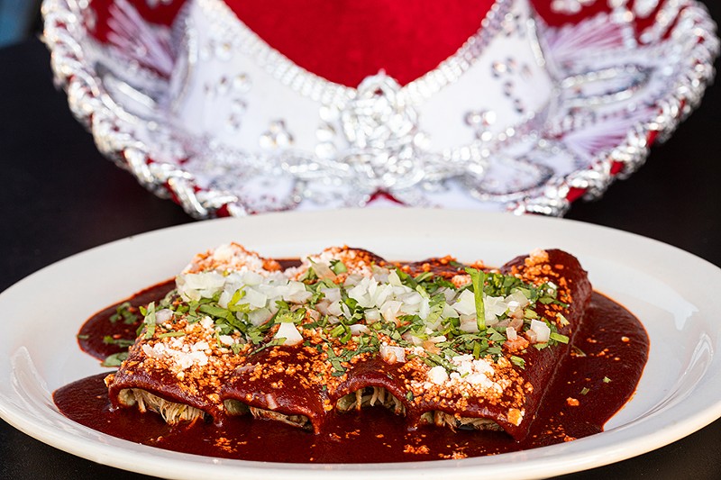Enchiladas, here pictured with mole, handmade tortillas and pulled chicken, are one of the restaurant's many Oaxacan specialties. - Mabel Suen
