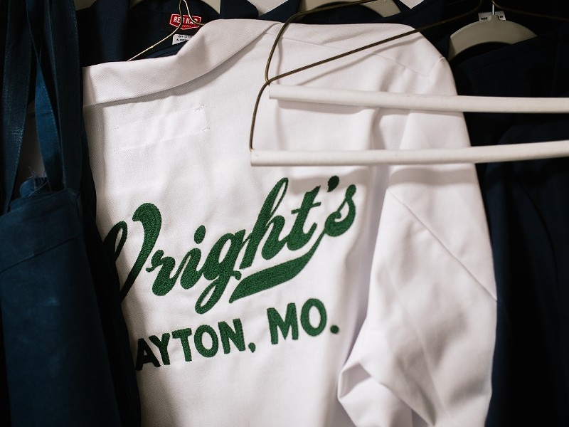 A chef coat embroidered with the Wright's Tavern logo.
