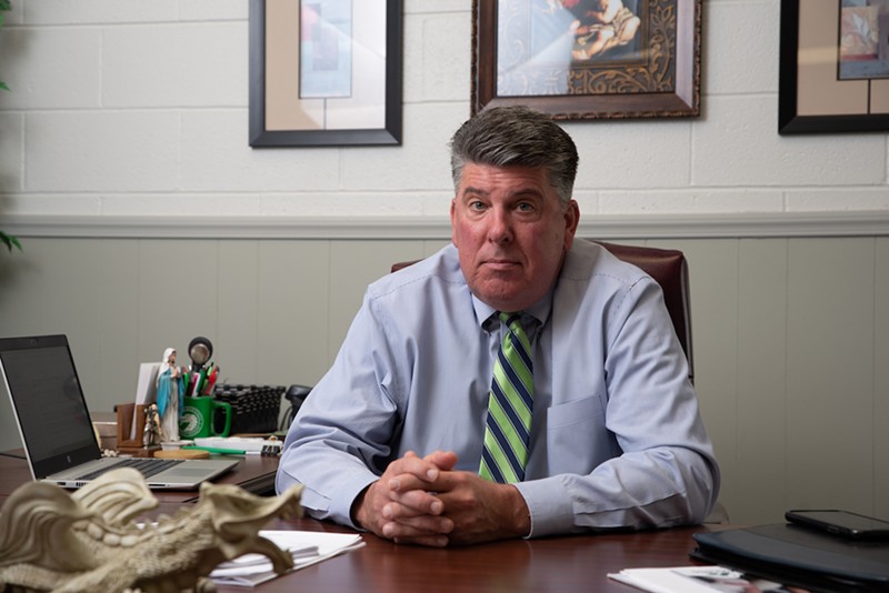 School president Mike England was so stressed in October that a blood vessel burst in his eye.