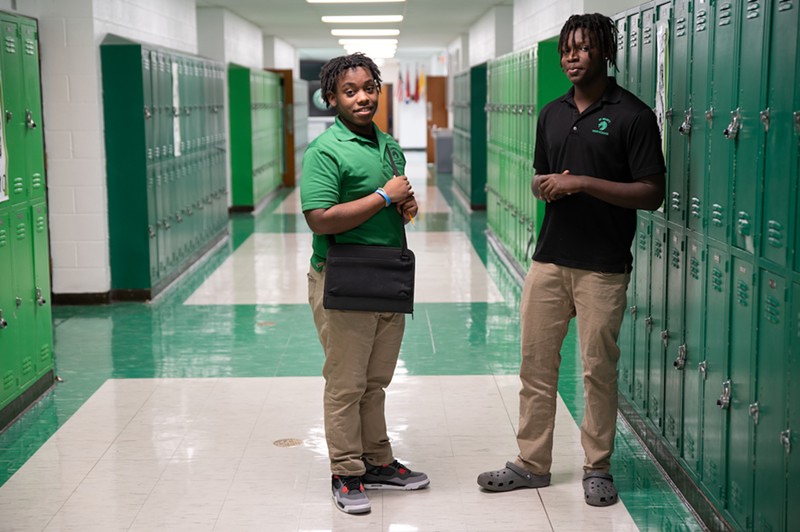 Two students stand in a hallway in St. Mary's.