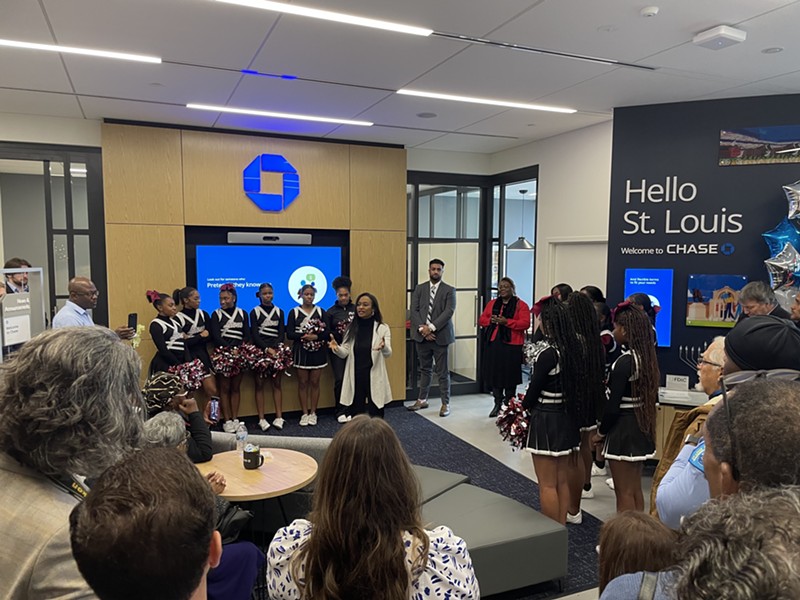Raquel Auden, Head of Network Expansion at Chase, addresses the gathering at the new Chase Bank at the Covenant Blu-Grand Center.  - BENJAMIN SIMON