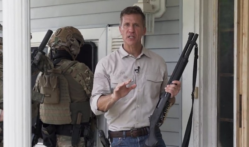 Eric Greitens and a paramilitary goon squad prepare to break into an empty house in Greitens memorable 2022 campaign ad.