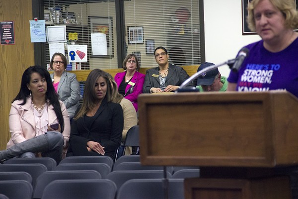 Thrive President Bridget Van Means (far left, in pink jacket) listens as a Parkway parent criticizes the Best Choice sex-ed program. - Photo by Danny Wicentowski