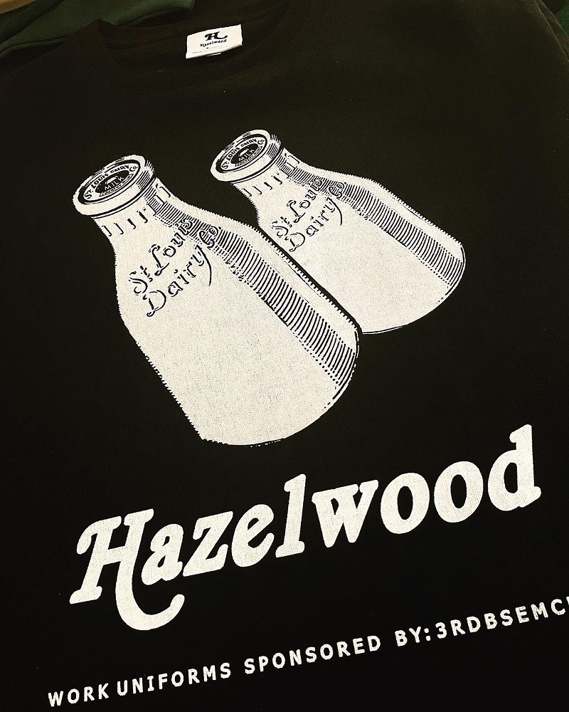 A picture of white milk cartons with the words Hazelwood against a black background.