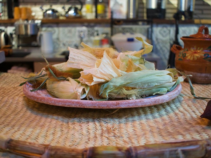A platter of corn adorns the coffee bar.