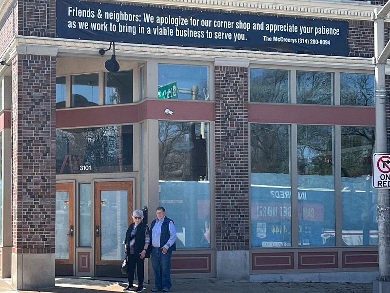 David and Beulah Ann McCreery in front of the banner they put above where their ice cream shop used to be.