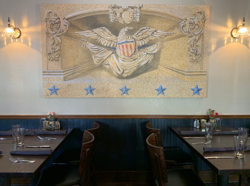 Local artist Zack Smithey was inspired by the original wallpaper of the Mother-in-Law House restaurant in his mural.