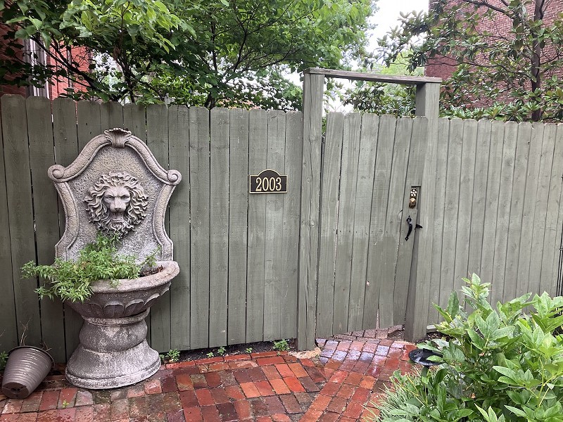 The "separate entrance" for the Airbnb is a fence that takes travelers into the patio that the Nedvideks are required in the lease to maintain. - SARAH FENSKE