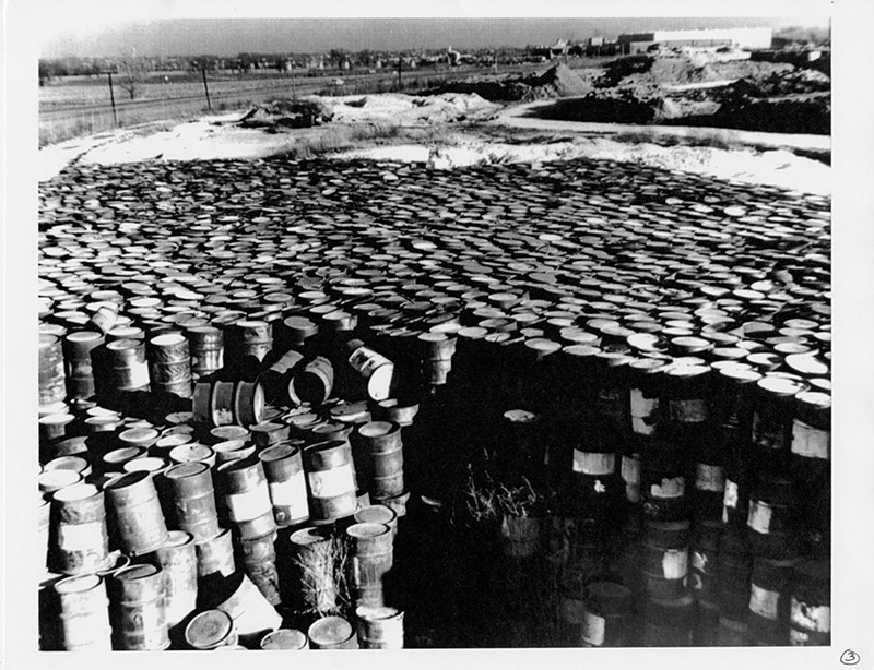 A photo taken in 1960 of deteriorating steel drums containing radioactive residues near Coldwater Creek, by the Mallinckrodt-St. Louis Sites Task Force Working Group.