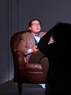 An actor performs an awkward chair turn during American Stage Sessions.