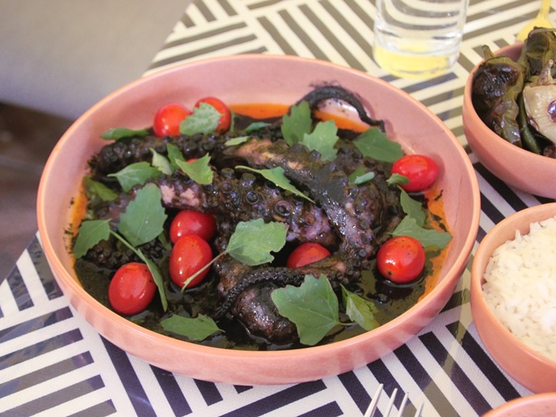 The pulpo en su tinta is an octopus braised in an ink sauce served with rice, roasted wax peppers and tortillas.