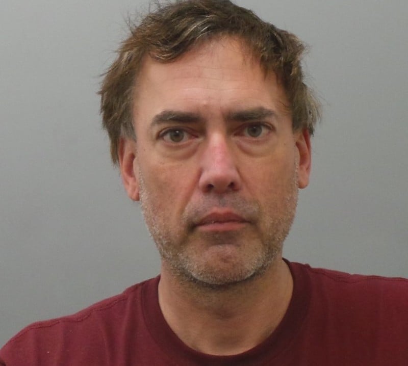 Robert Merkle, shown in a 2022 booking photo, was previously convicted of harassing women.