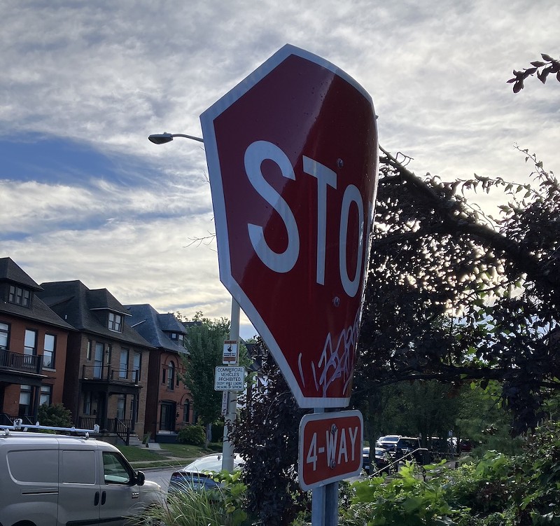 A corrugated stop sign gets bent in the city's Shaw neighborhood on September 6. - SARAH FENSKE