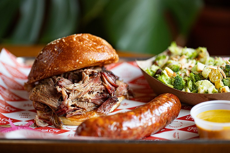 Fourth City’s one-meat sandwich with pulled pork, pictured here with jalapeño-cheddar sausage and broccoli salad.