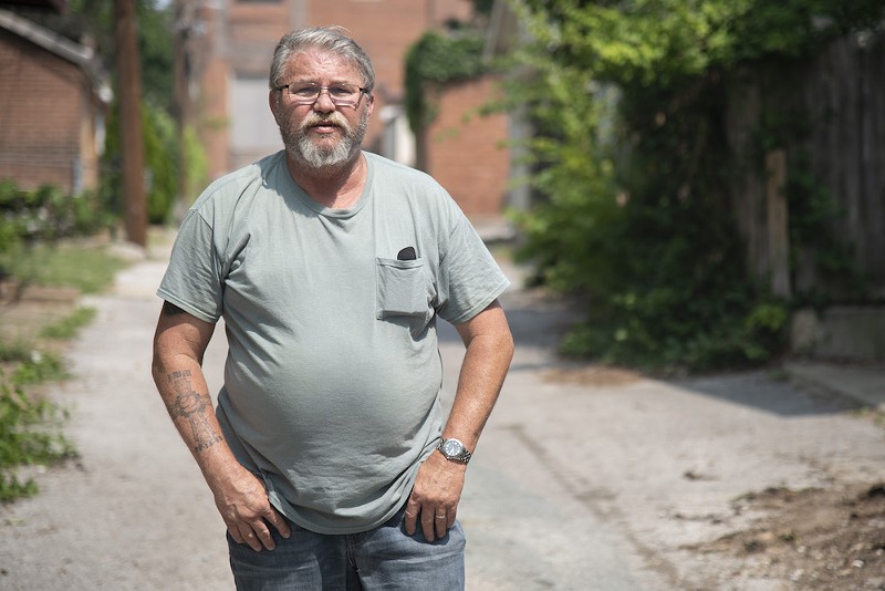 Former St. Louis police detective Roger Murphey poses for a portrait Friday, June 16, 2023, in an alley behind buildings on Shenandoah Avenue. - JACOB WIEGAND