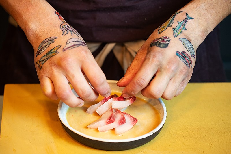 Nick Bognar works his magic behind the sushi bar.