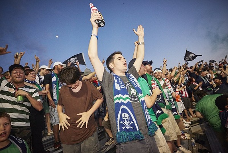 St. Louis soccer fans celebrate Saint Louis FC. The team's fan club supports Props 1 and 2, but the author — a big soccer fan — does not. - PHOTO BY STEVE TRUESDELL