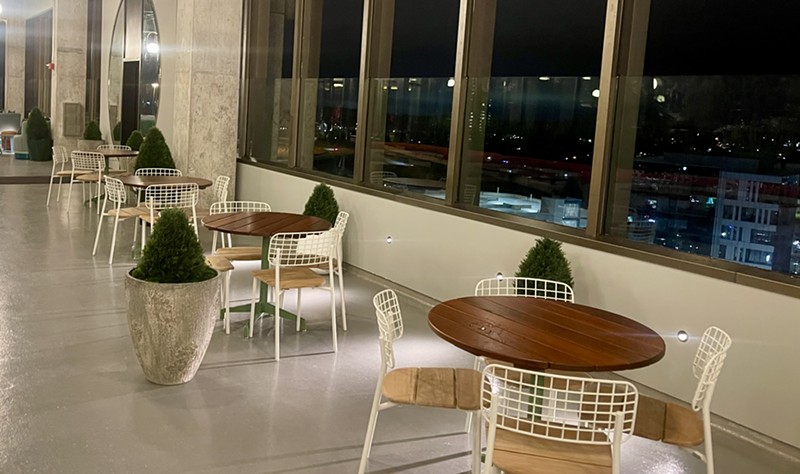 The open-air patio provides more seating with cozy fire pits, greenery and Westport Plaza views while still being protected from nature's elements.