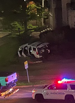 Neighbor Francisco Gonzales captured this image of a police SUV after it crashed into Westminster Presbyterian Church's welcome sign. - FRANCISCO GONZALES