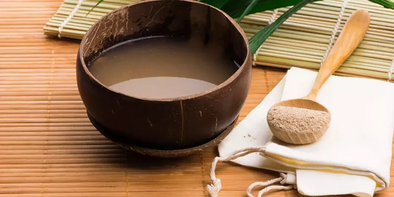 People enjoying kava beverages at a bar, reflecting the growing trend and controversy around kava use.