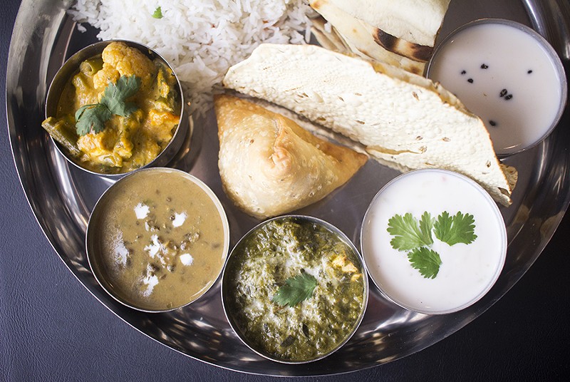 Yogi thali includes vegetable korma, palak paneer, dal makhani, naan, rice, raita and kheer. - MABEL SUEN