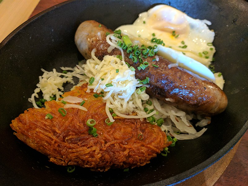 The Bavarian sausage comes with crispy potatoes, sauerkraut and your choice of eggs. - PHOTO BY DANNY WICENTOWSKI