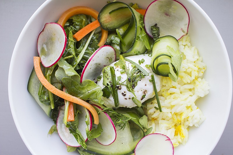 The turmeric and ginger rice bowl includes spring vegetables, whey and poached egg. - PHOTO BY MABEL SUEN